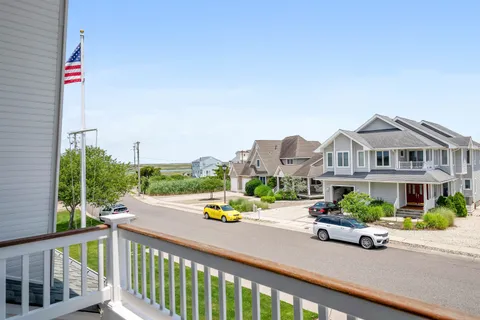 a view of a balcony with chairs