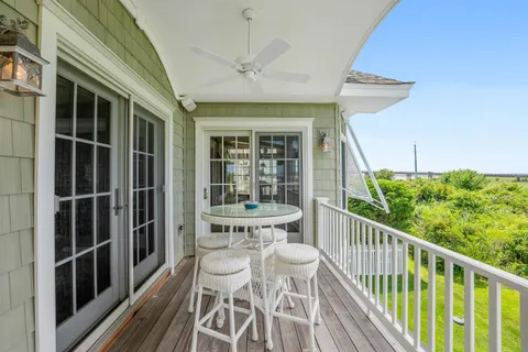 a view of a swimming pool with a table and chairs