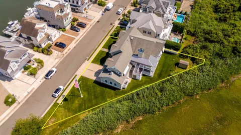 an aerial view of a house with a garden and swimming pool