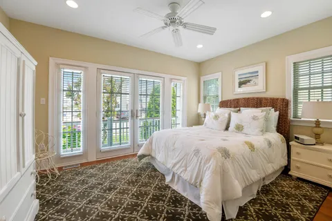 a spacious bedroom with a large bed and a window