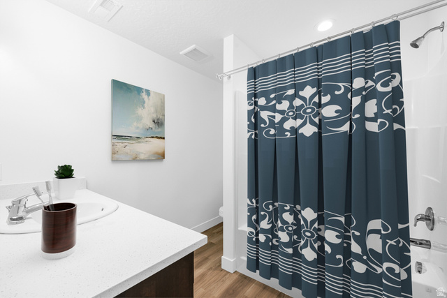1503 South Deerbrook Road, Unit 348 Santaquin, UT 84655 - Photo 9 of 14 Bathroom featuring vanity, light wood finished floors, and shower / tub combo
