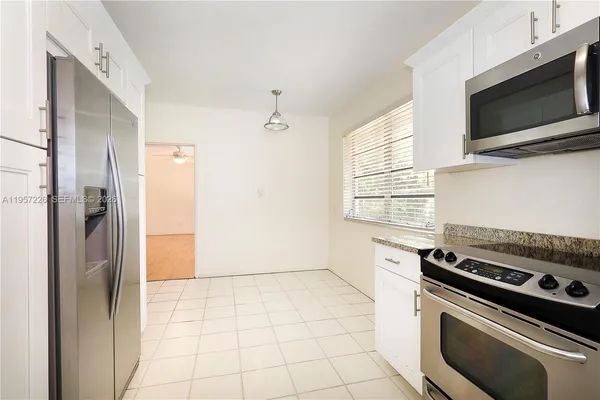a kitchen with a stove and a microwave