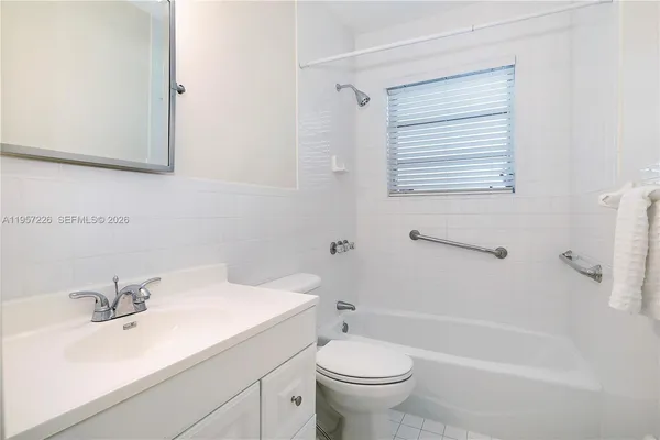 a bathroom with a sink a toilet and a bathtub