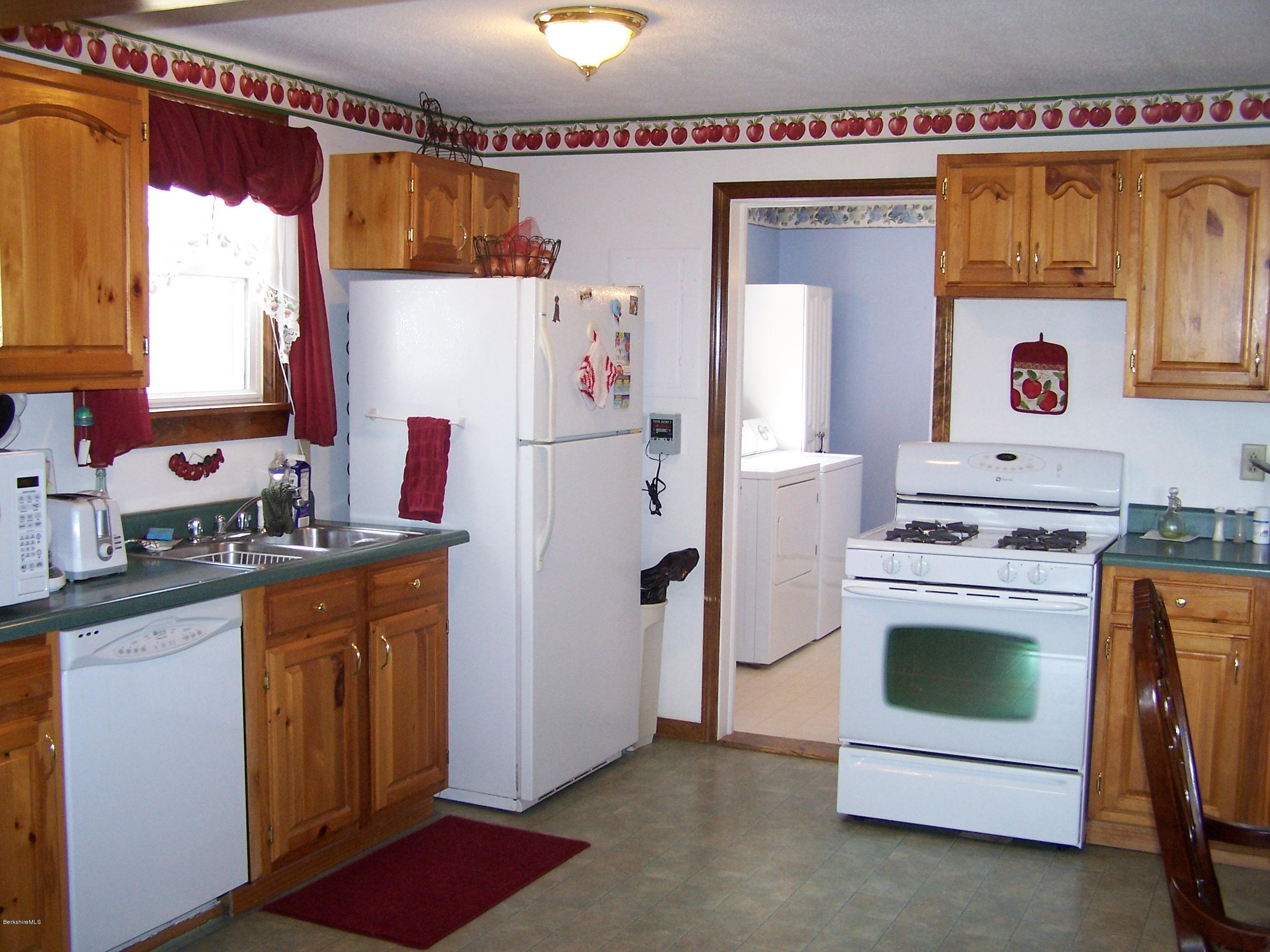 29 S Road Peru, MA 01235 - Photo 4 of 25 a white refrigerator freezer sitting in a kitchen
