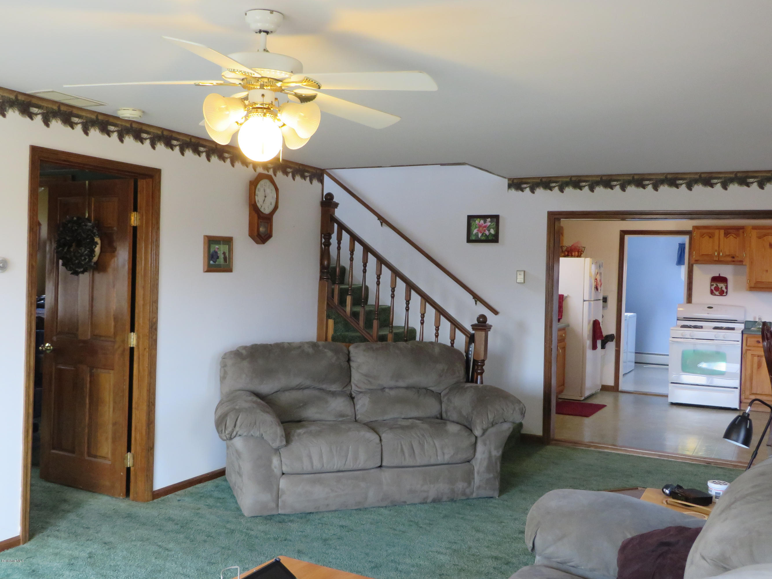 29 S Road Peru, MA 01235 - Photo 7 of 25 a living room with furniture and a chandelier