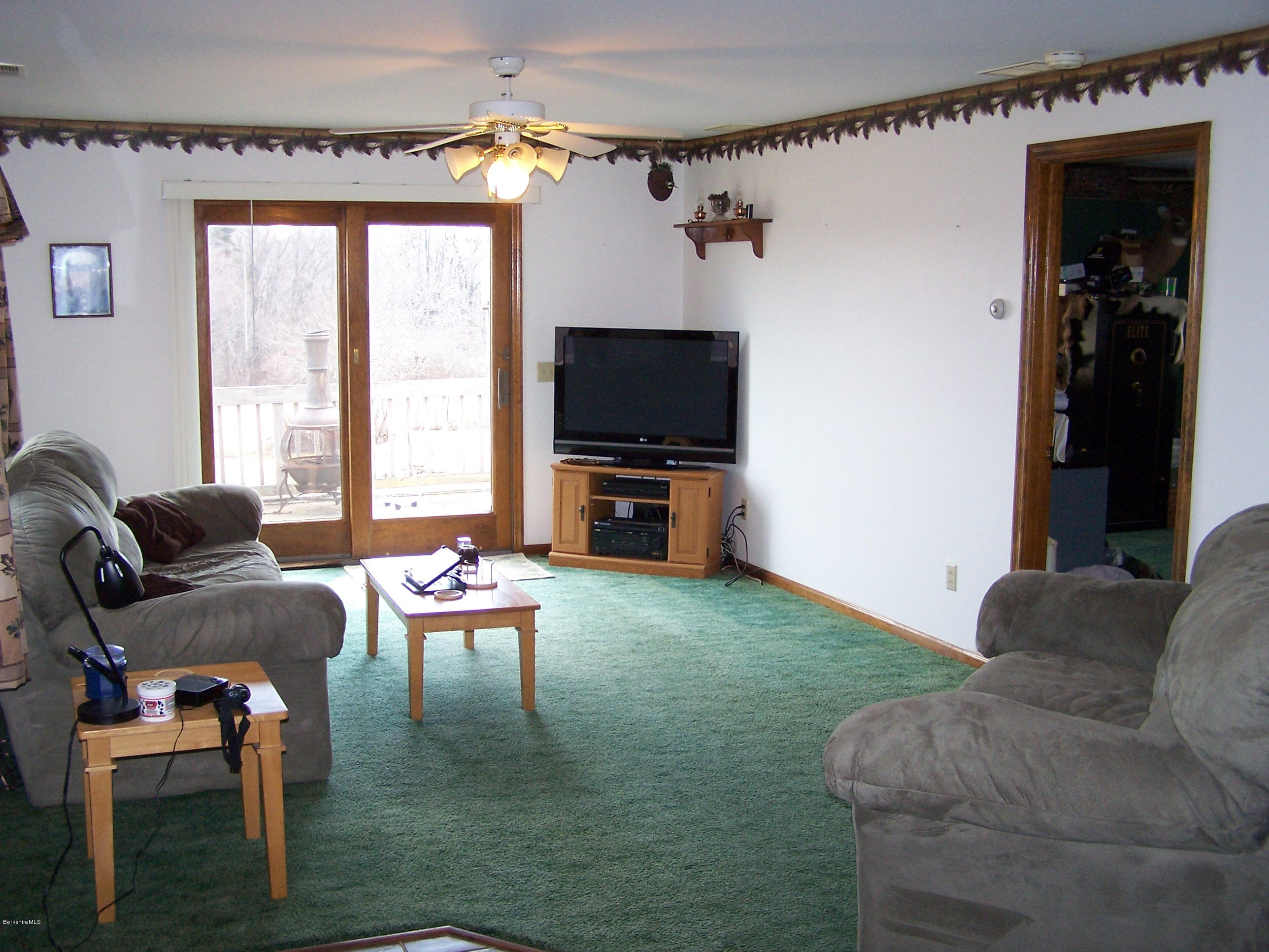 29 S Road Peru, MA 01235 - Photo 8 of 25 a living room with furniture and a flat screen tv