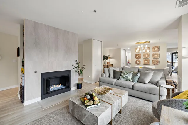 a view of a dining room with furniture and chandelier