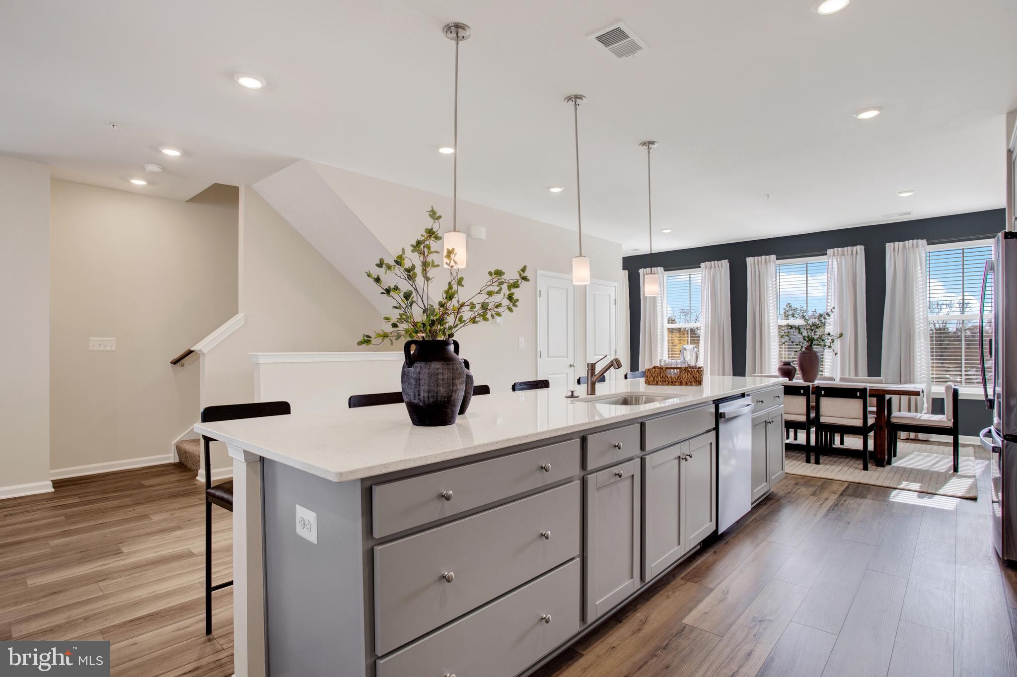 9666 Swallowtail Lane Manassas, VA 20110 - Photo 11 of 92 Wentworth Model - Kitchen with Pendant Lights