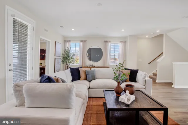 a bedroom with a bed and a large mirror