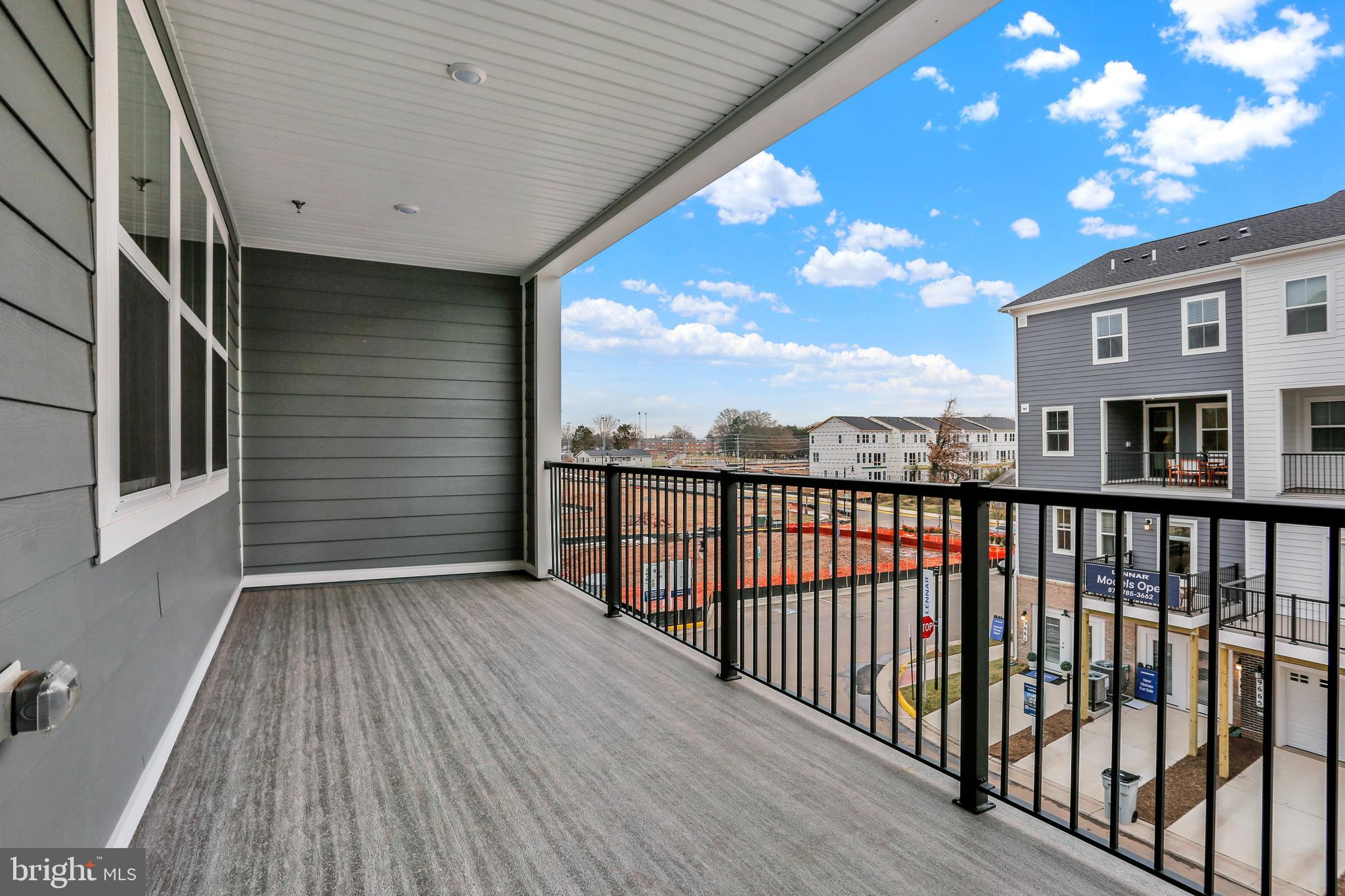 9666 Swallowtail Lane Manassas, VA 20110 - Photo 29 of 92 a view of a porch with wooden floor and outdoor space