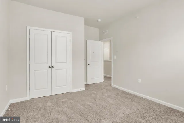 an aerial view of residential houses with city view