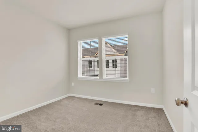 an aerial view of residential houses with city view