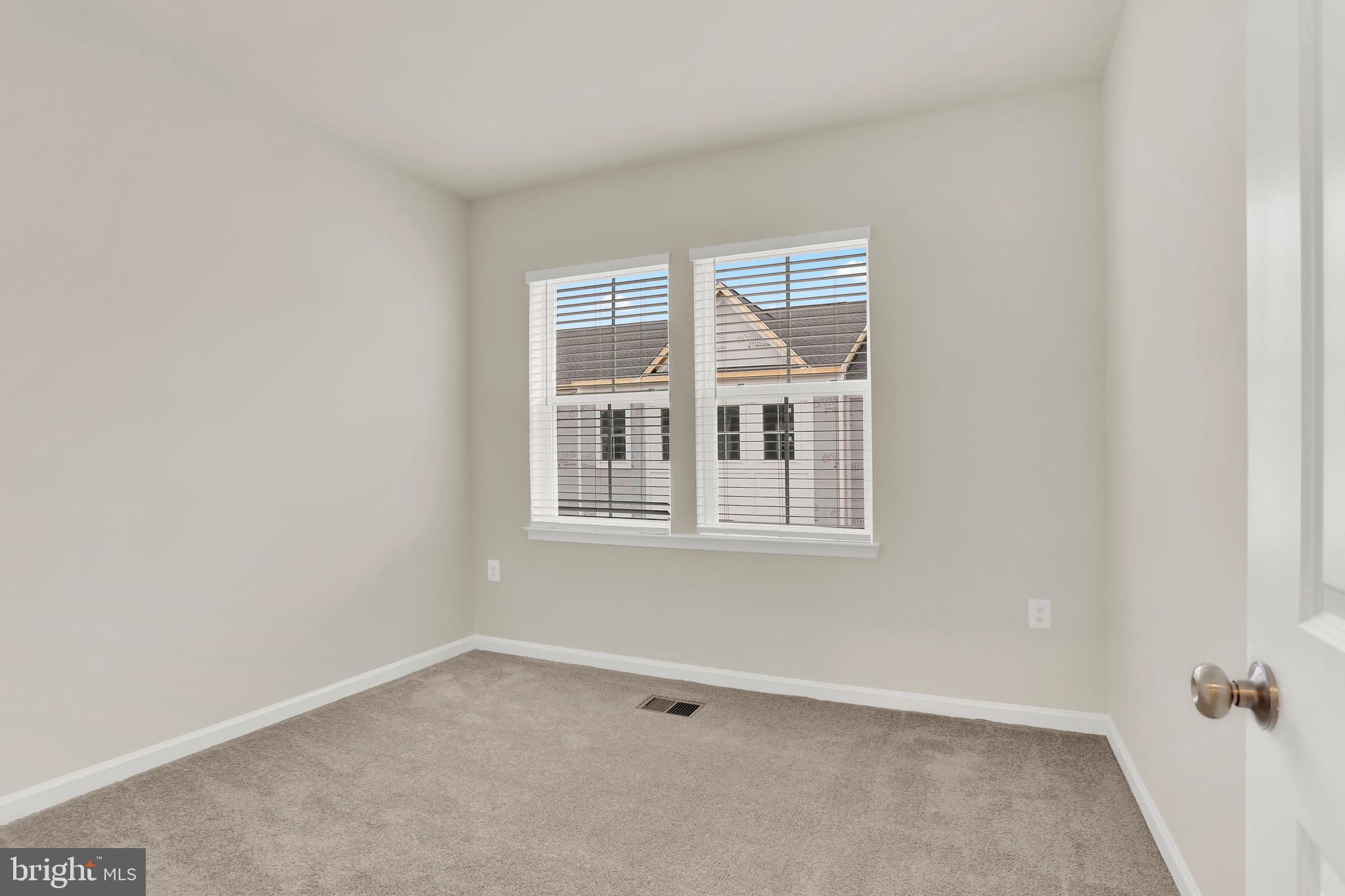9666 Swallowtail Lane Manassas, VA 20110 - Photo 42 of 92 a view of an empty room with a window
