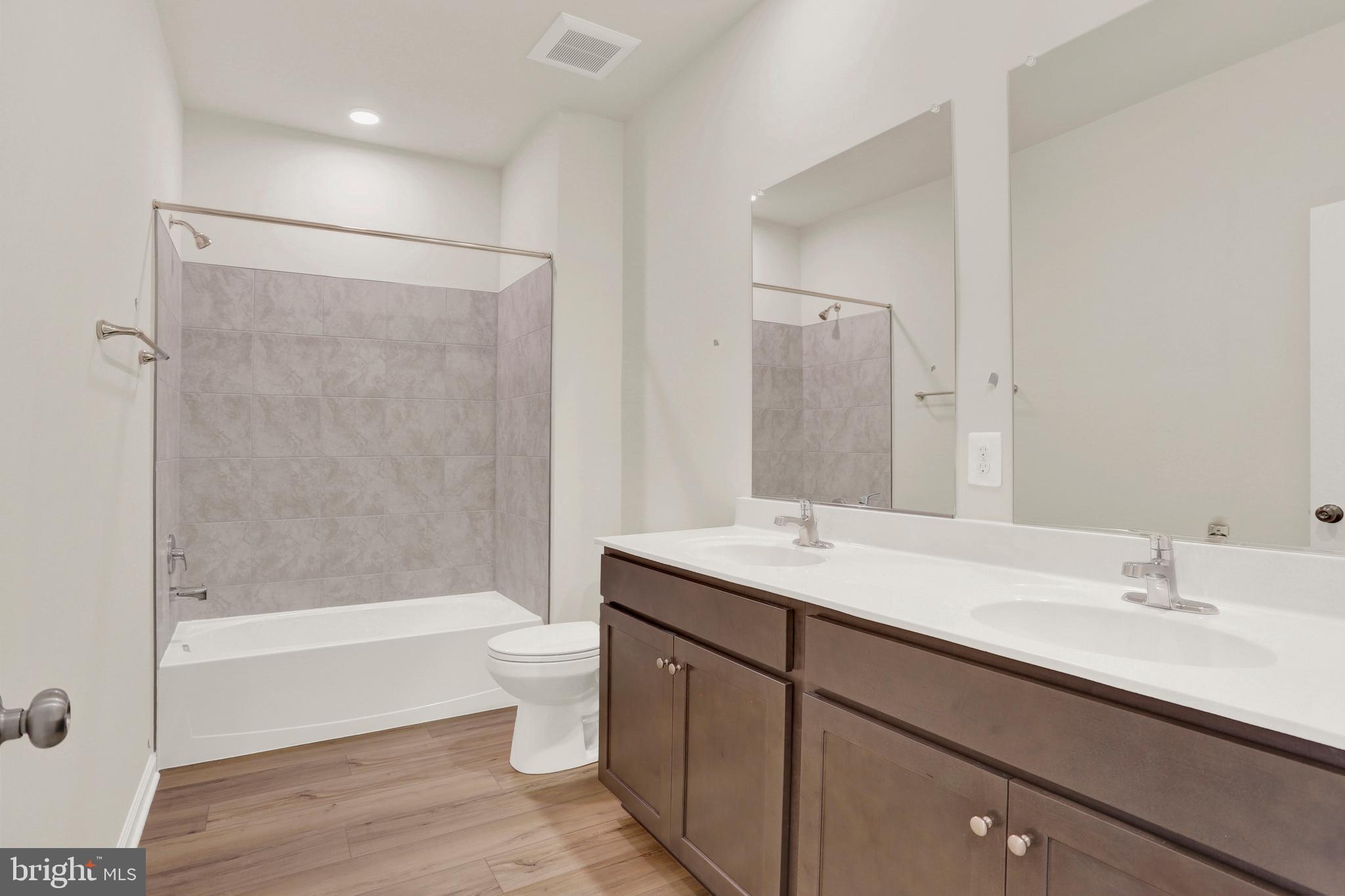 9666 Swallowtail Lane Manassas, VA 20110 - Photo 46 of 92 a bathroom with a sink a toilet and shower