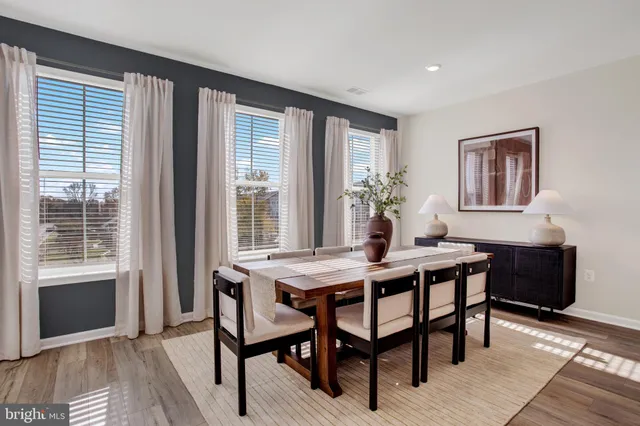 a large room with lots of counter space and windows