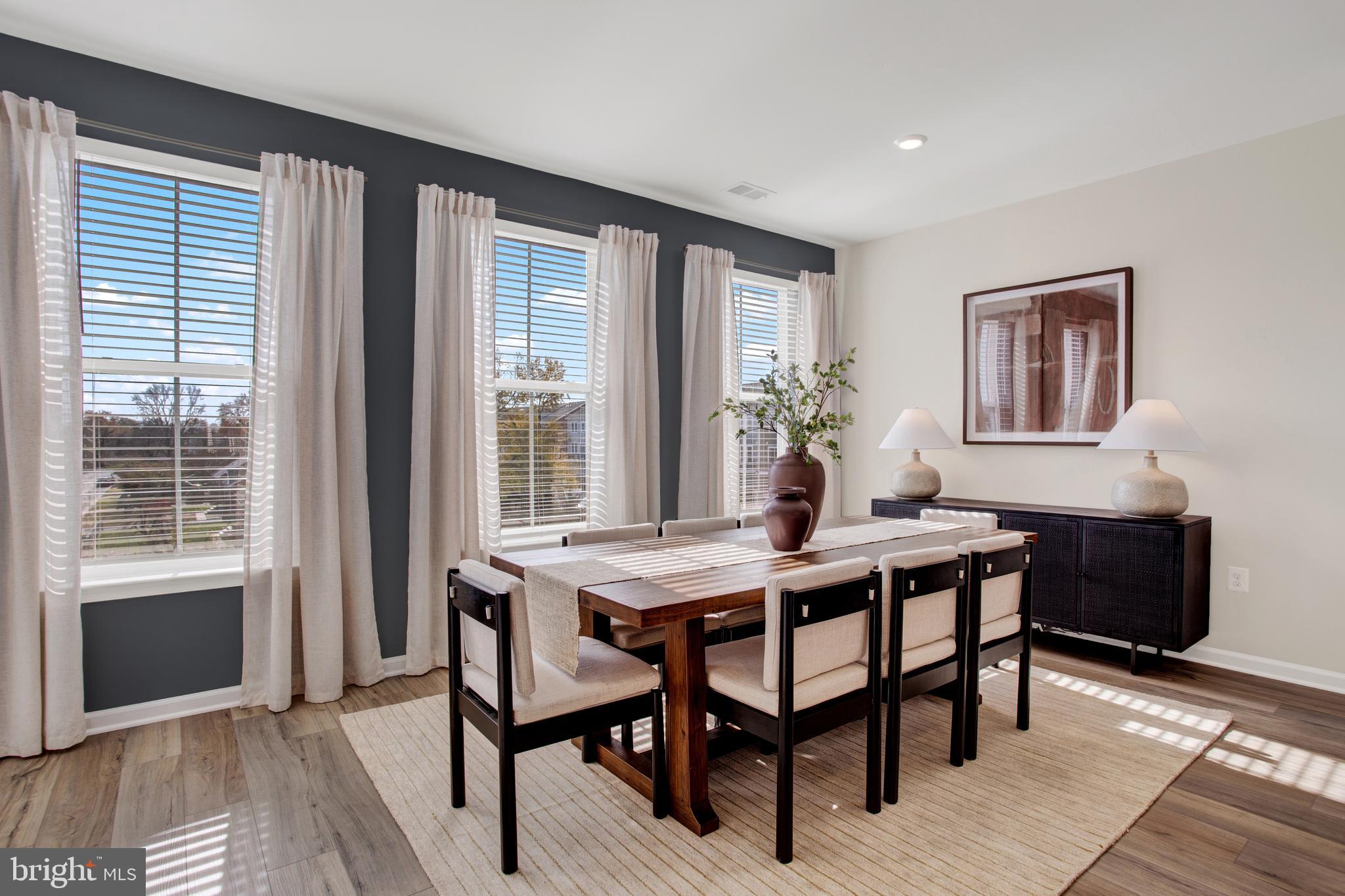9666 Swallowtail Lane Manassas, VA 20110 - Photo 7 of 92 a view of a dining room with furniture and window