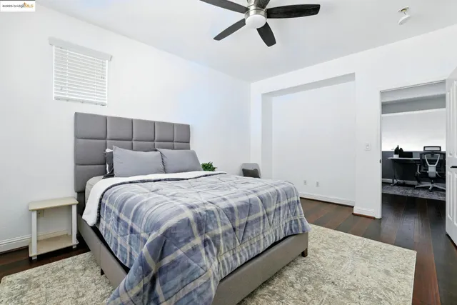 a bedroom with a bed and a chair