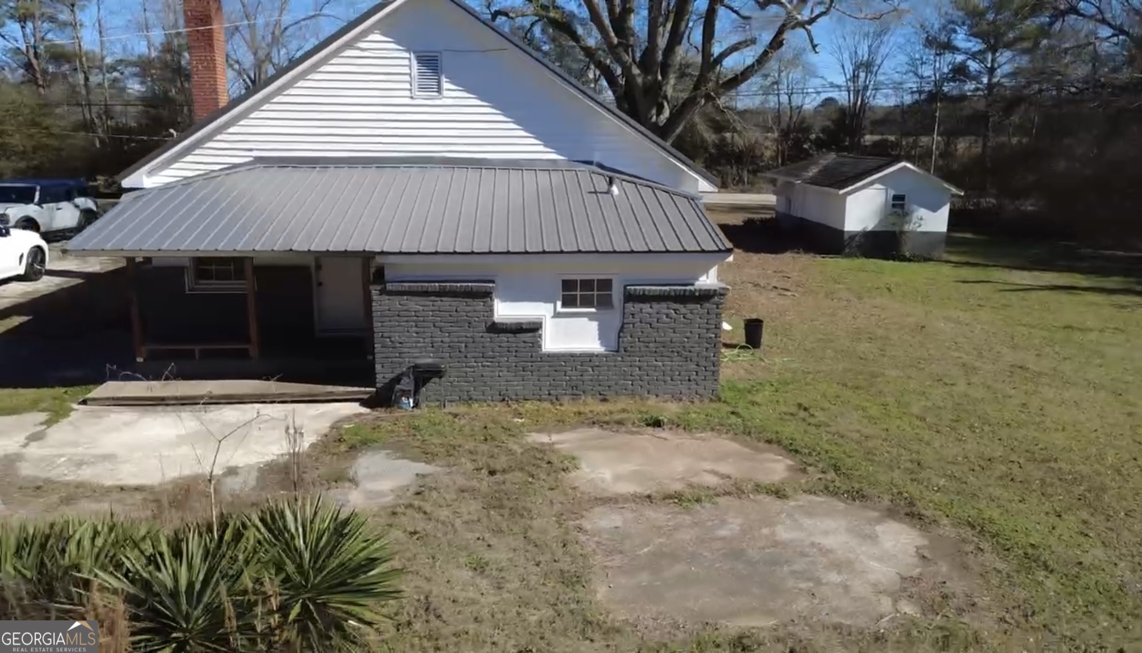2936 Whitesville Road LaGrange, GA 30240 - Photo 14 of 42 a backyard of a house with garage