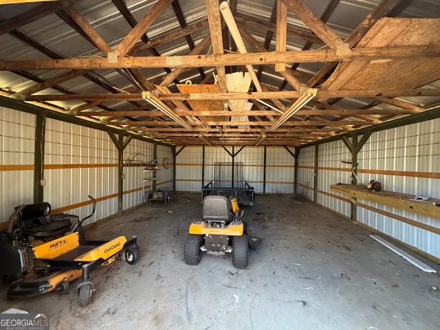 a living room with furniture a window and a chandelier