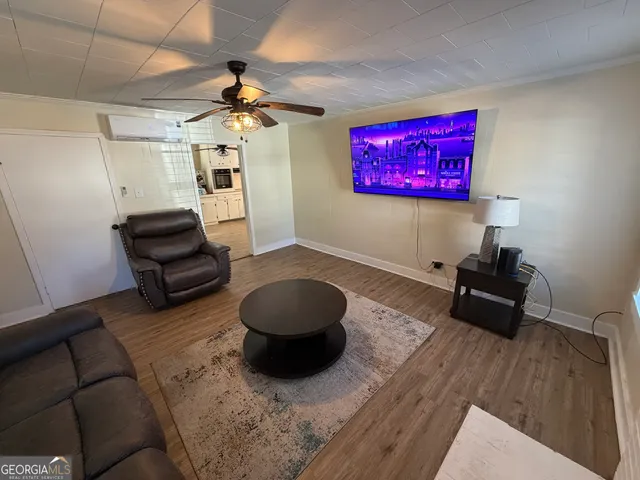 a kitchen with a refrigerator and a stove top oven