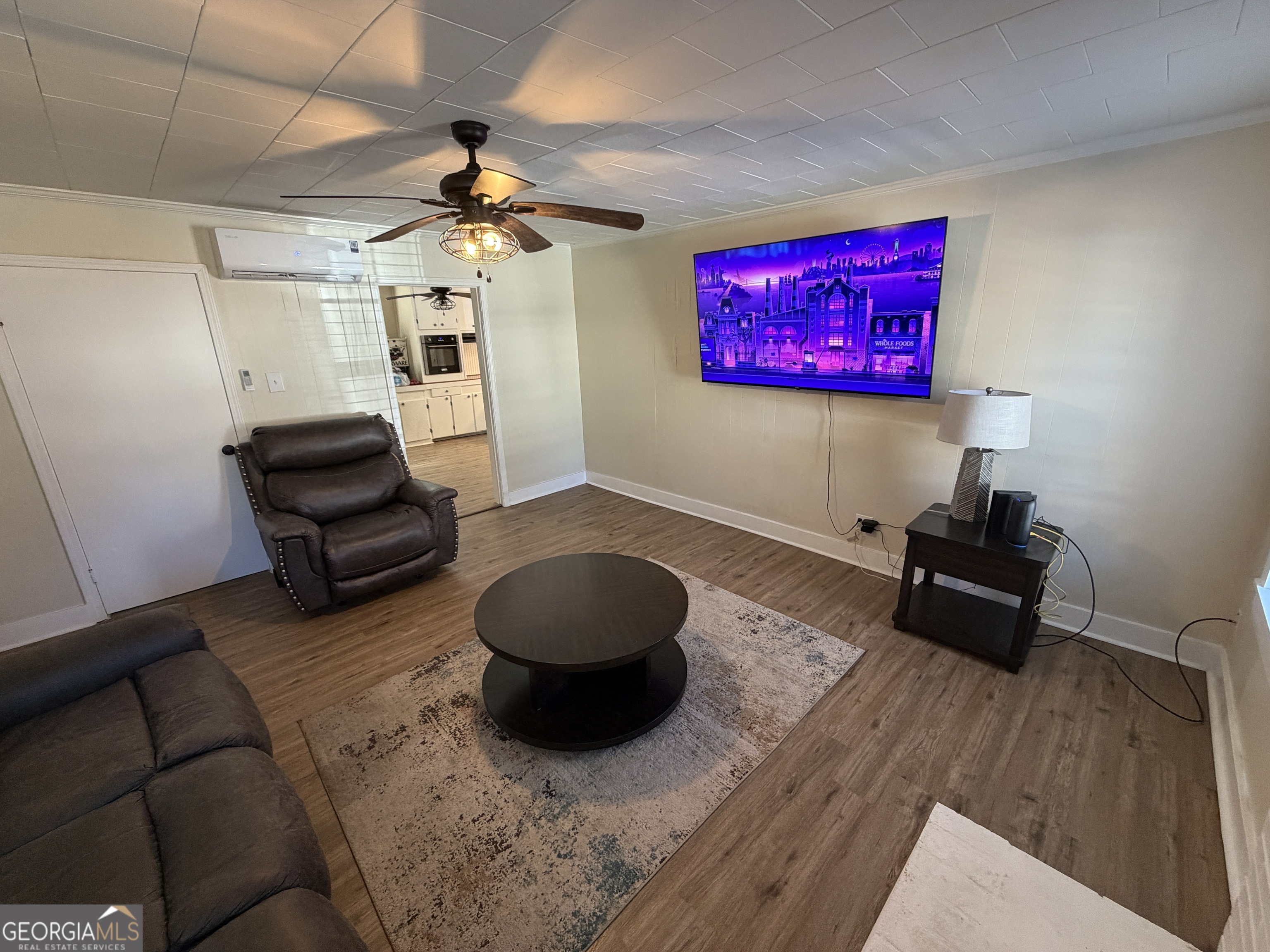 2936 Whitesville Road LaGrange, GA 30240 - Photo 26 of 42 a living room with furniture and a wooden floor