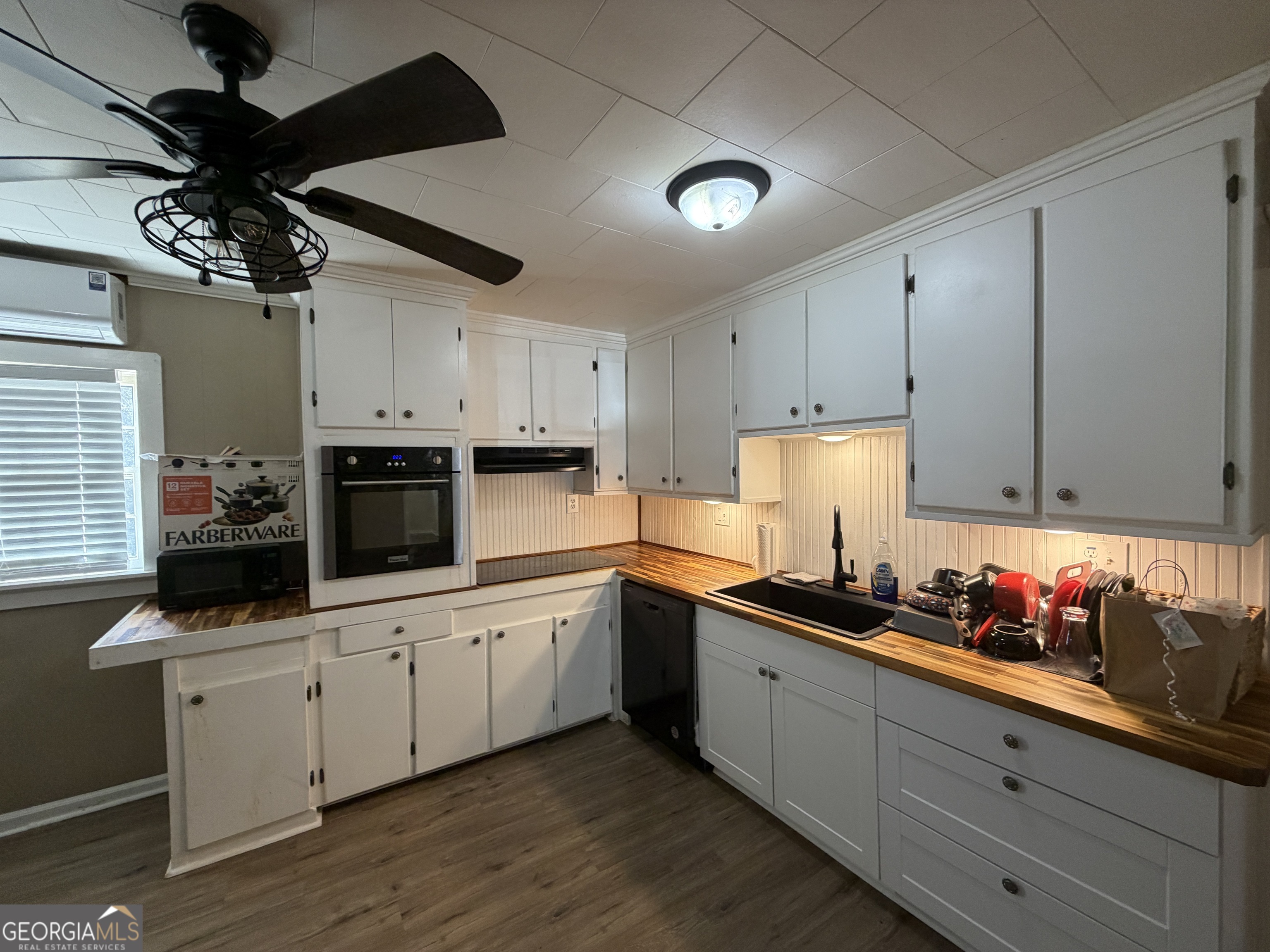 2936 Whitesville Road LaGrange, GA 30240 - Photo 30 of 42 a kitchen with granite countertop a sink cabinets and stainless steel appliances