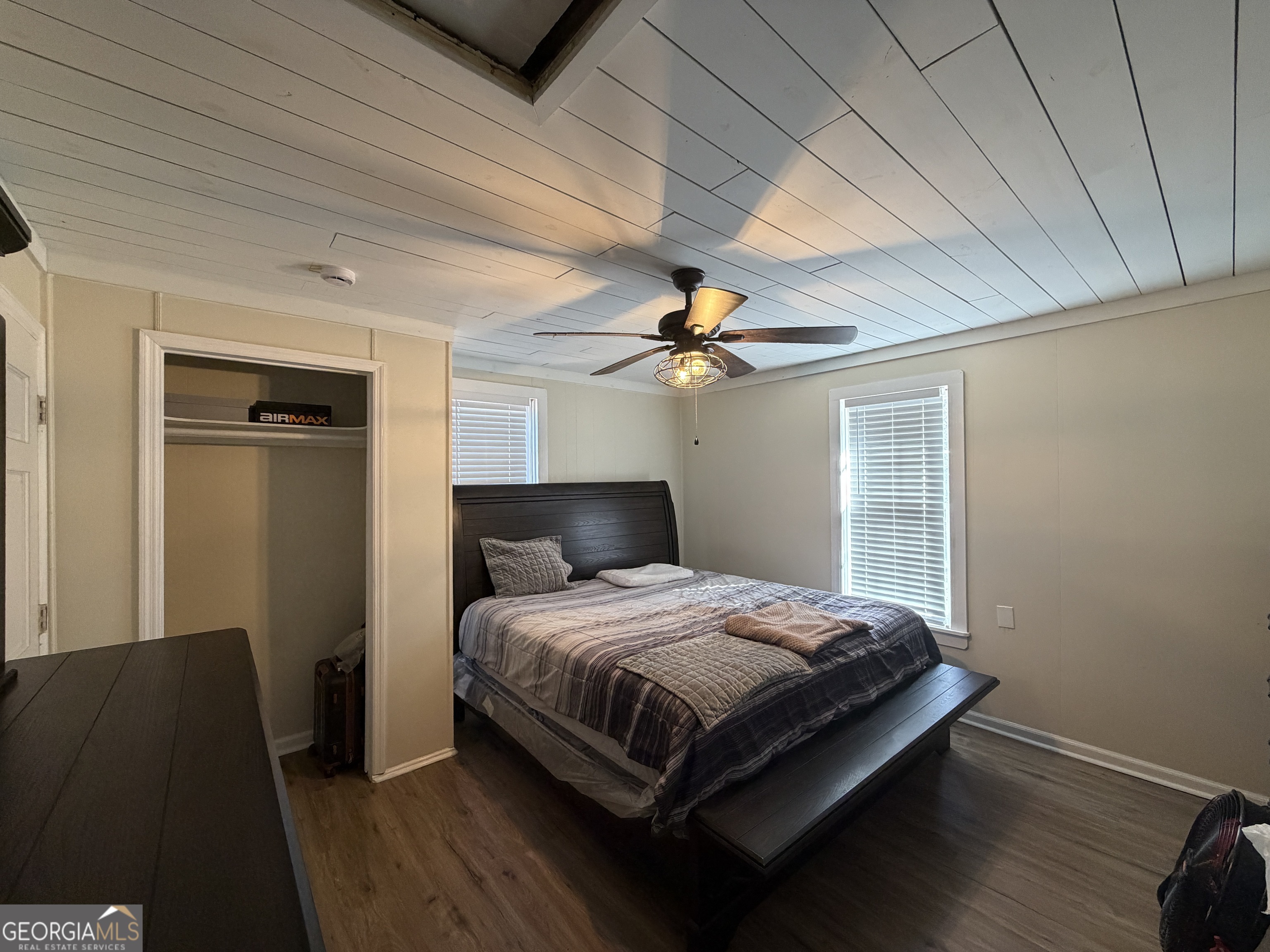 2936 Whitesville Road LaGrange, GA 30240 - Photo 32 of 42 a bedroom with a bed and wooden floor