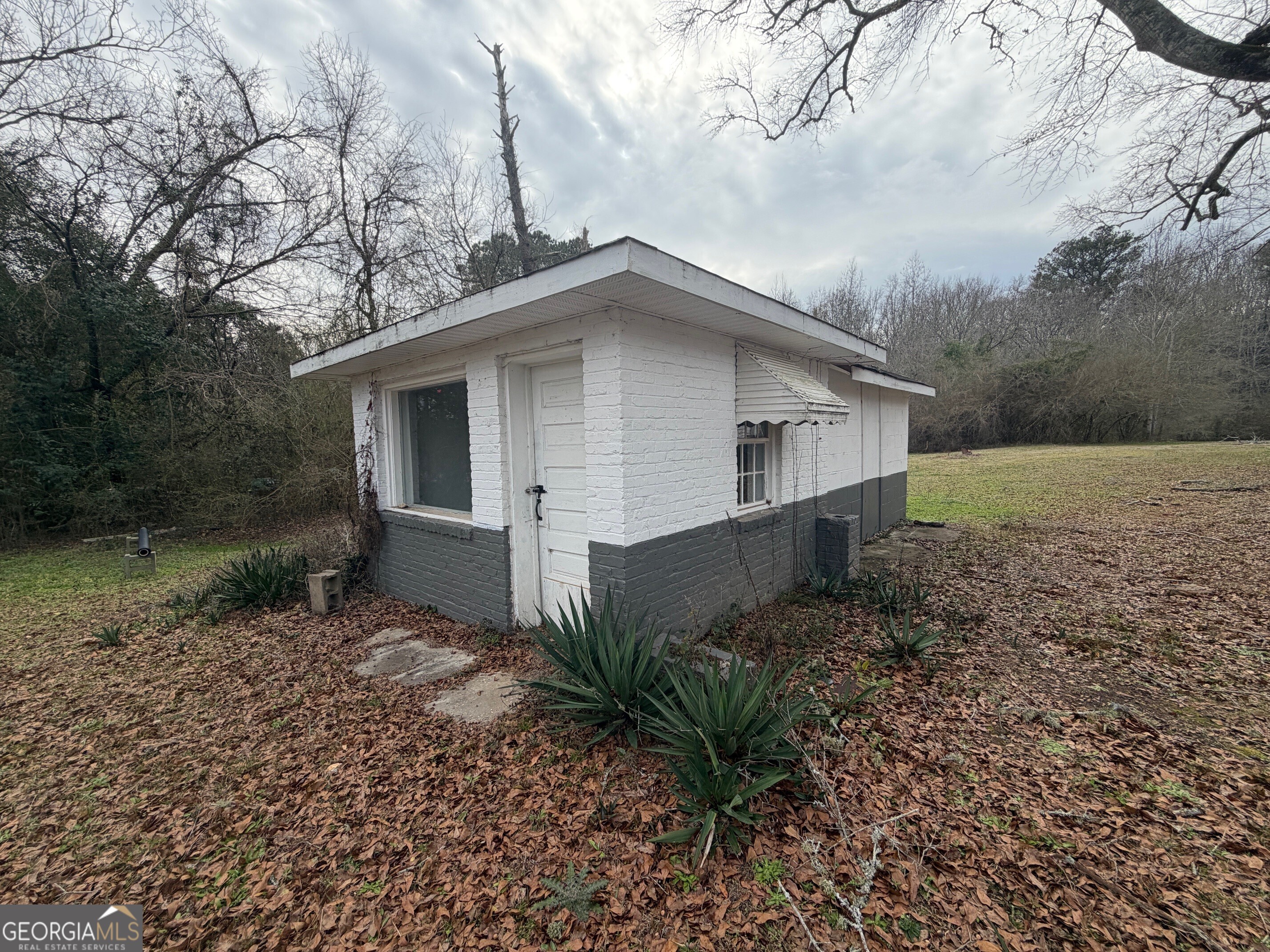 2936 Whitesville Road LaGrange, GA 30240 - Photo 39 of 42 a view of a house with a yard and large trees