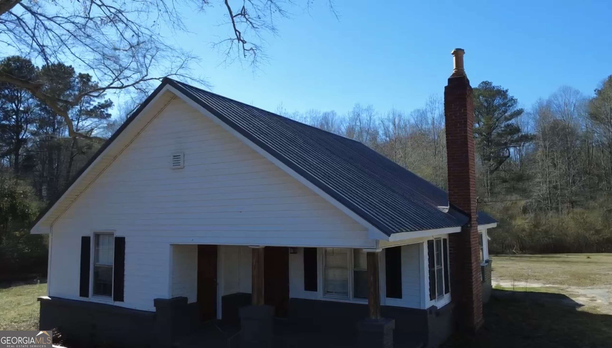 2936 Whitesville Road LaGrange, GA 30240 - Photo 5 of 42 a backyard of a house with table and chairs