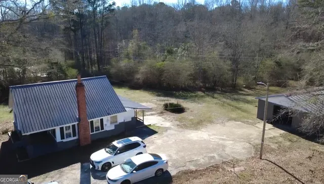 a view of balcony with wooden floor and fence