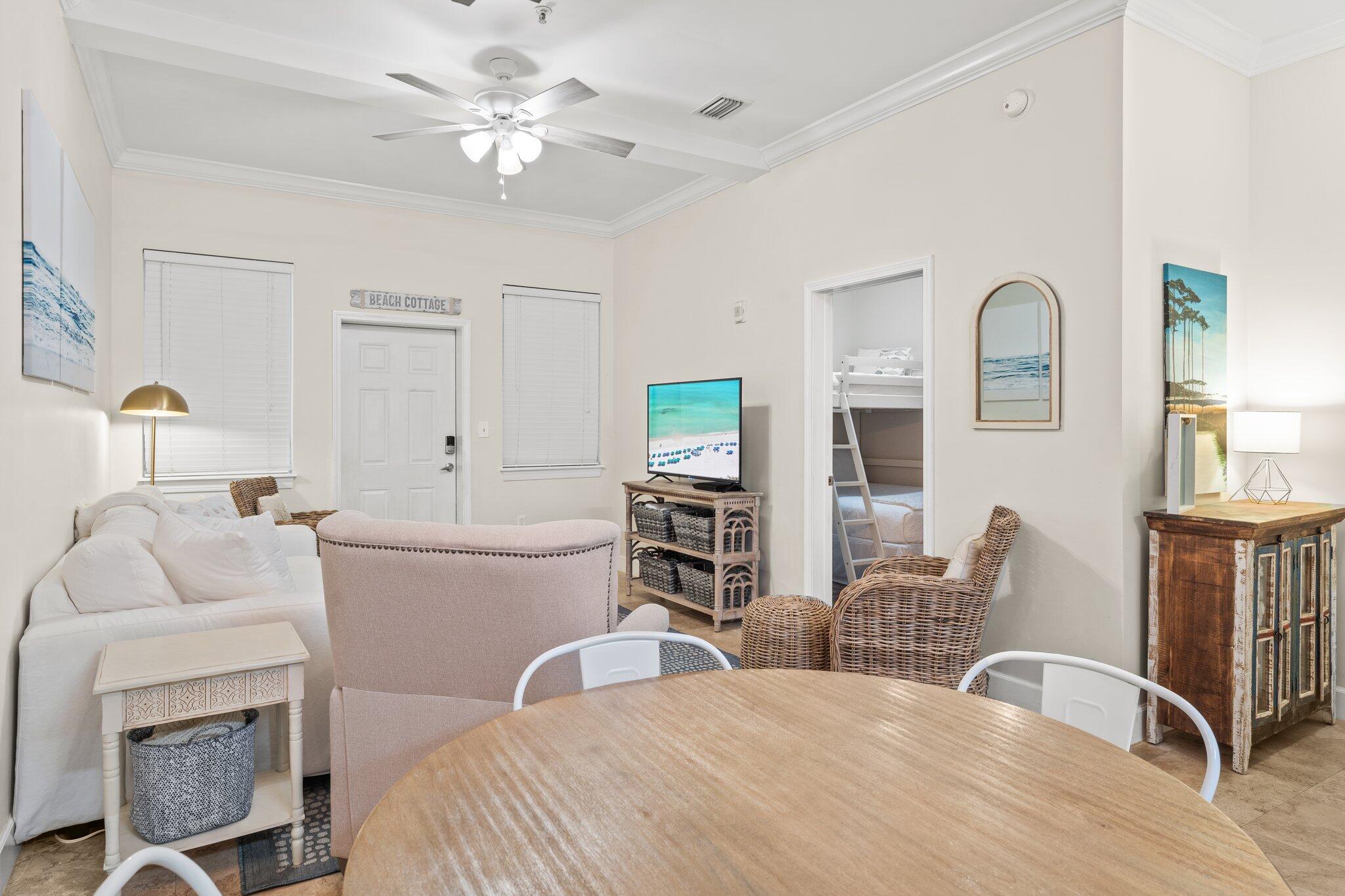 231 Somerset Bridge Road, Unit 1110 Santa Rosa Beach, FL 32459 - Photo 17 of 51 a bedroom with a bed and a chandelier