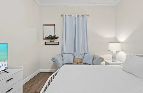 a bedroom with a bed and a dresser