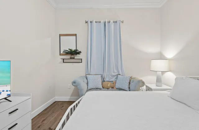 a bedroom with a bed and a dresser