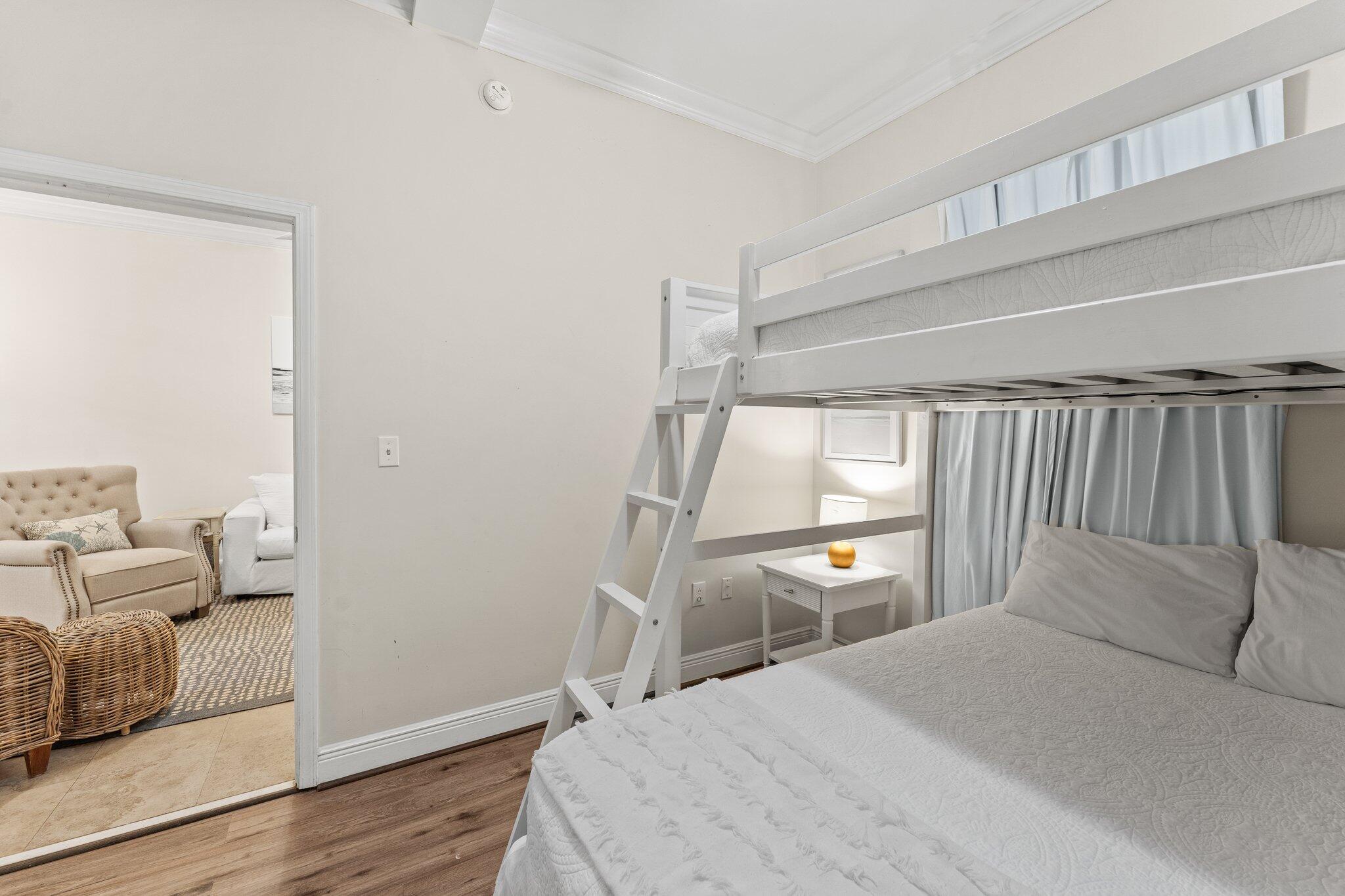 231 Somerset Bridge Road, Unit 1110 Santa Rosa Beach, FL 32459 - Photo 26 of 51 a bedroom with a bed and wooden floor