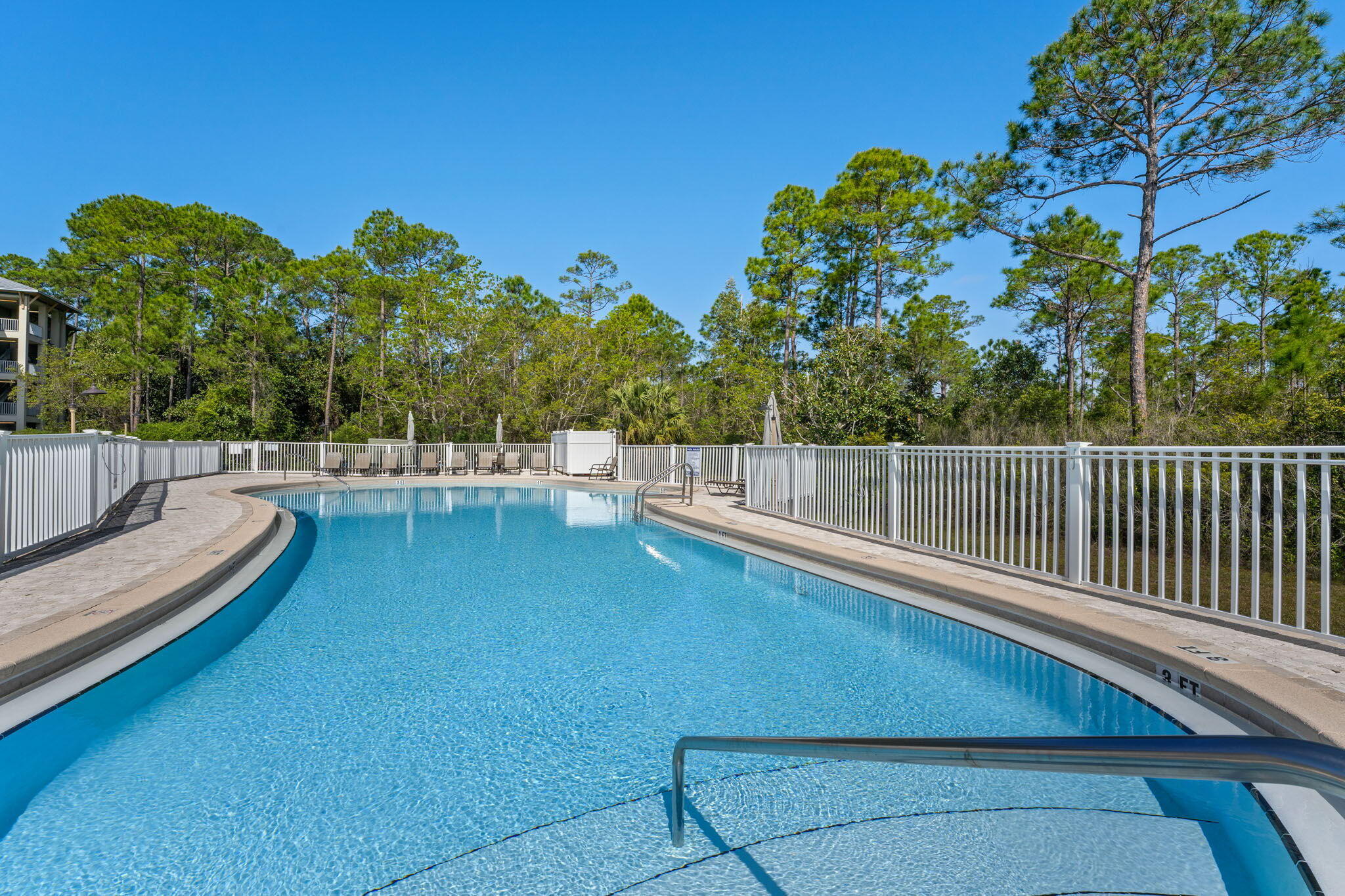 231 Somerset Bridge Road, Unit 1110 Santa Rosa Beach, FL 32459 - Photo 30 of 51 a view of a swimming pool with a lounge chair