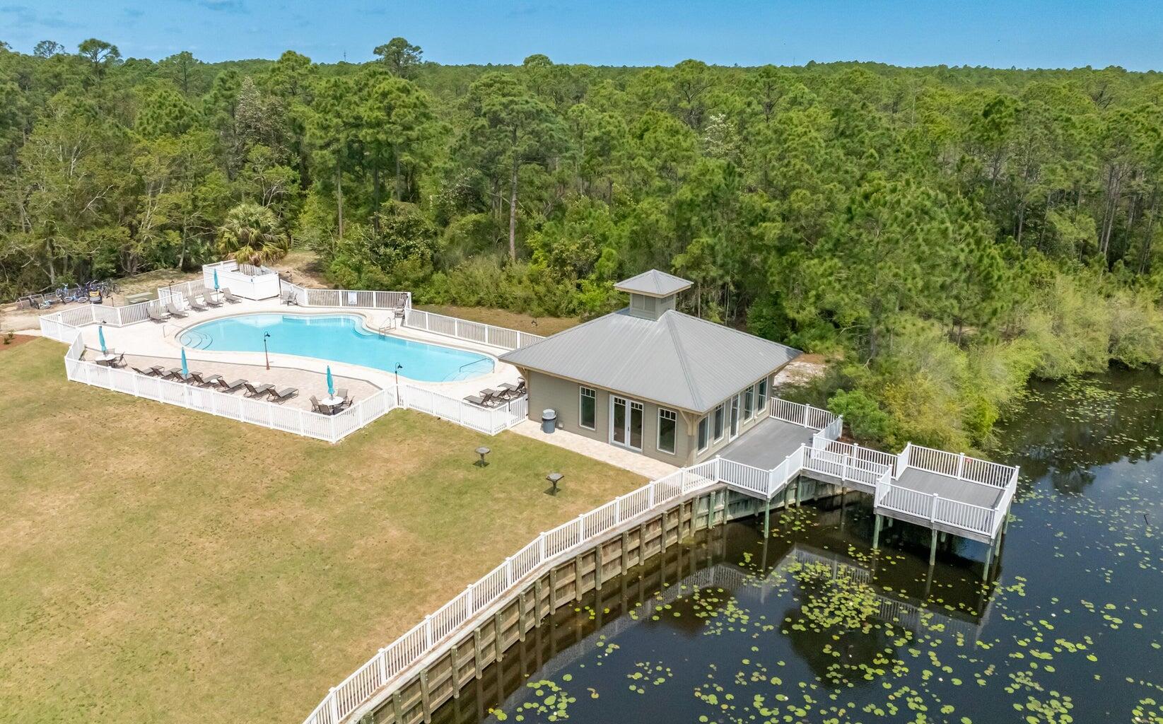 231 Somerset Bridge Road, Unit 1110 Santa Rosa Beach, FL 32459 - Photo 32 of 51 a view of a patio with a table and chairs