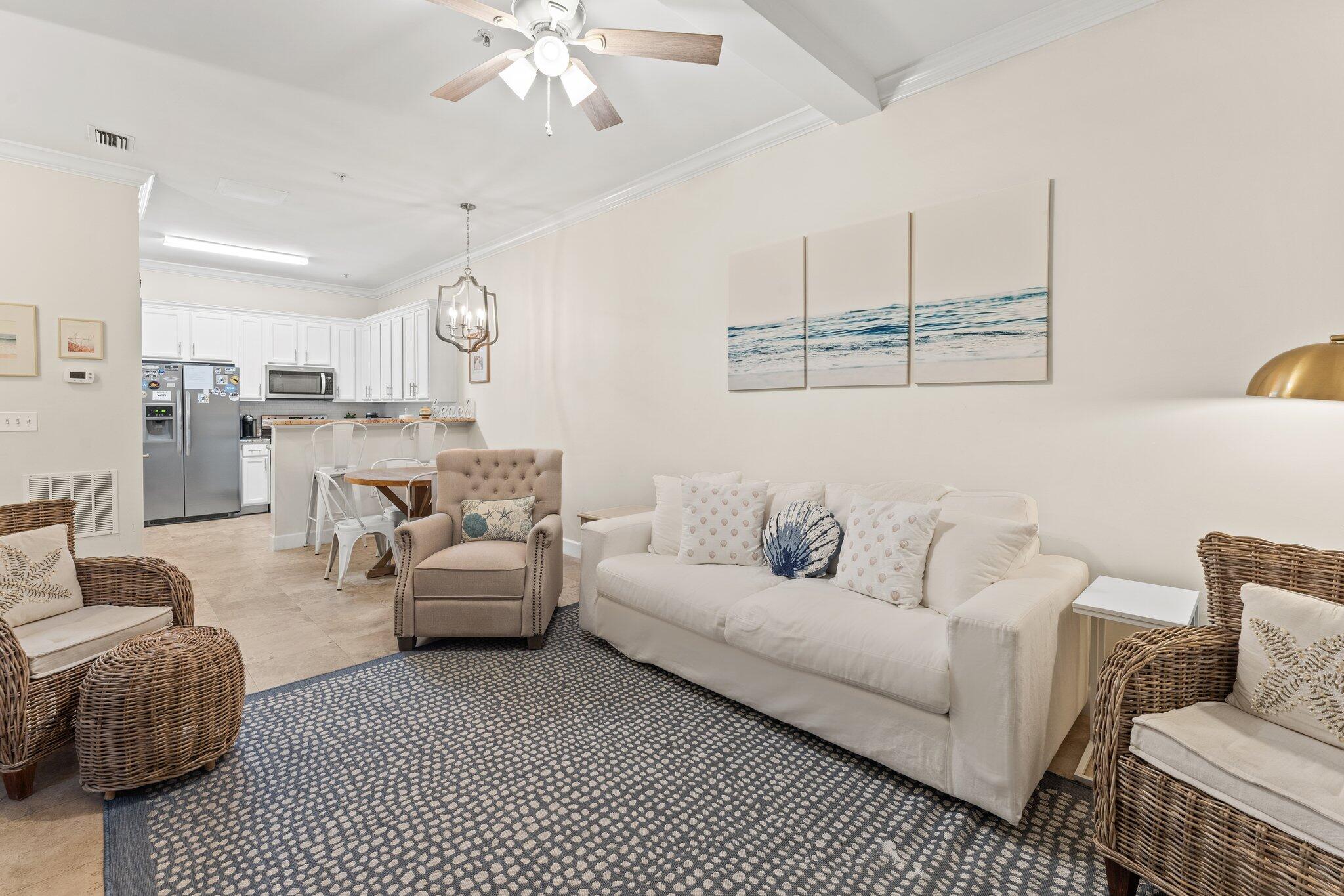 231 Somerset Bridge Road, Unit 1110 Santa Rosa Beach, FL 32459 - Photo 4 of 51 a living room with furniture and a chandelier