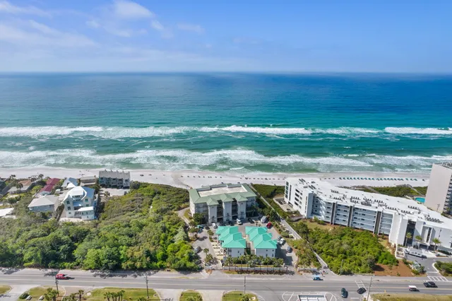 a view of a chairs and table in patio