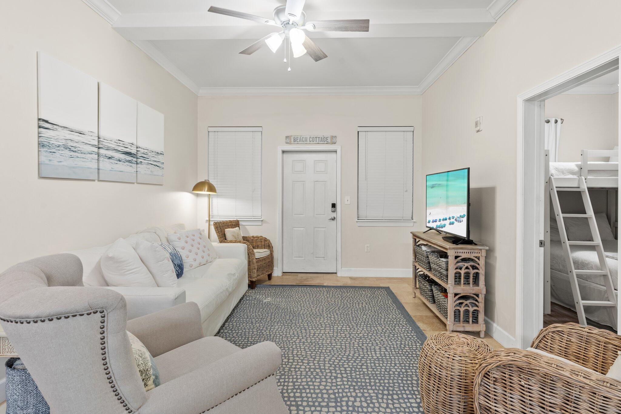 231 Somerset Bridge Road, Unit 1110 Santa Rosa Beach, FL 32459 - Photo 6 of 51 a living room with furniture and a flat screen tv