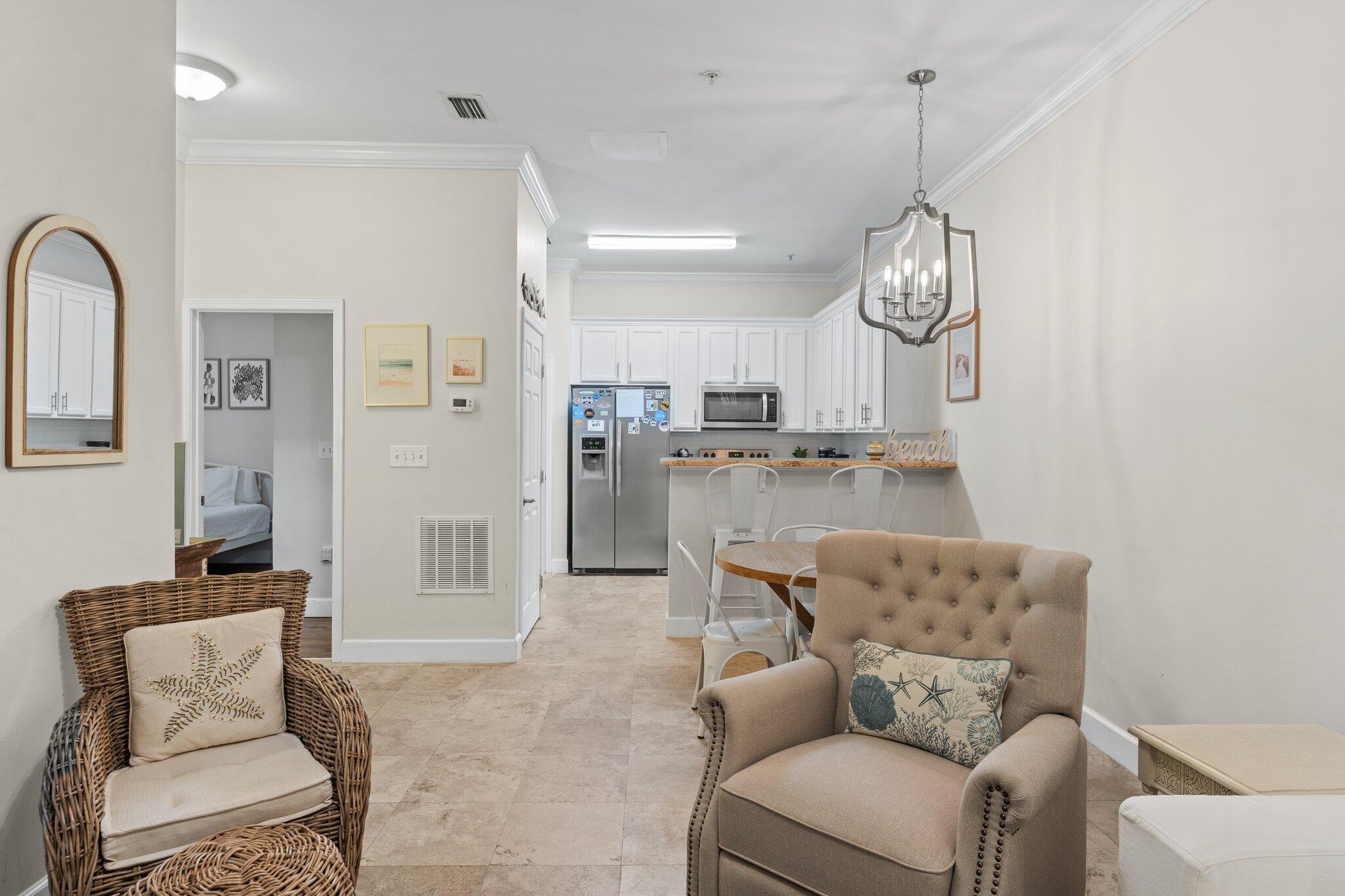 231 Somerset Bridge Road, Unit 1110 Santa Rosa Beach, FL 32459 - Photo 10 of 51 a living room with furniture kitchen and a chandelier
