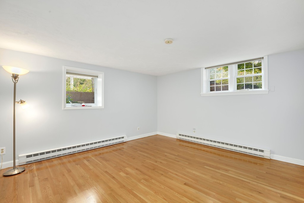 5 Porter Road, Unit A2 Andover, MA 01810 - Photo 11 of 22 a view of a room with wooden floor and window