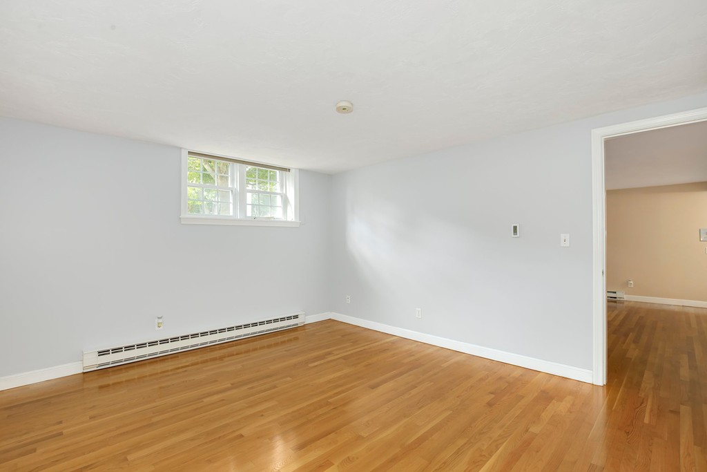 5 Porter Road, Unit A2 Andover, MA 01810 - Photo 12 of 22 a view of a room with wooden floor and white walls