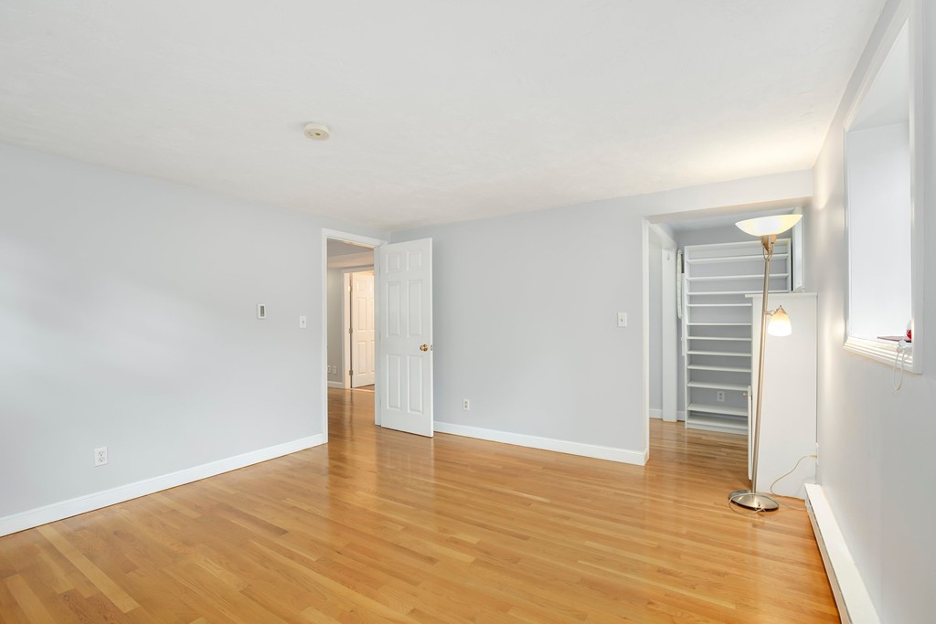 5 Porter Road, Unit A2 Andover, MA 01810 - Photo 13 of 22 a view of an empty room with wooden floor