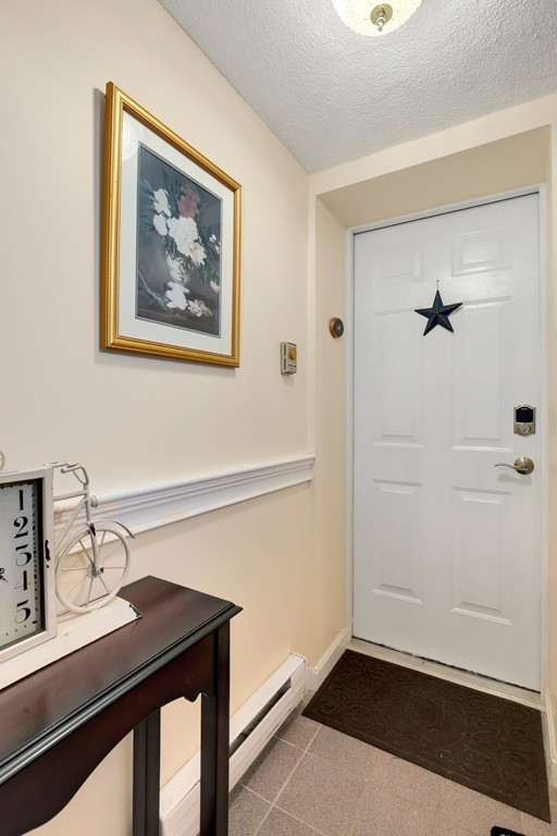 5 Porter Road, Unit A2 Andover, MA 01810 - Photo 18 of 22 a view of a bathroom with a sink and a mirror