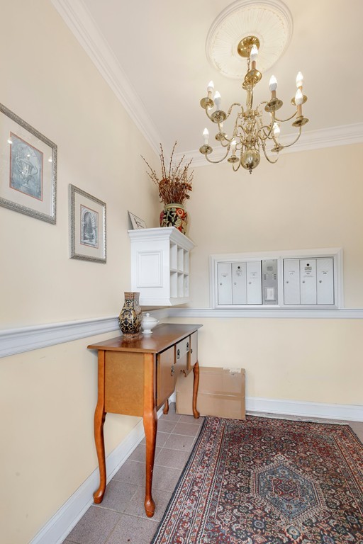 5 Porter Road, Unit A2 Andover, MA 01810 - Photo 19 of 22 a view of a dining room with furniture and chandelier
