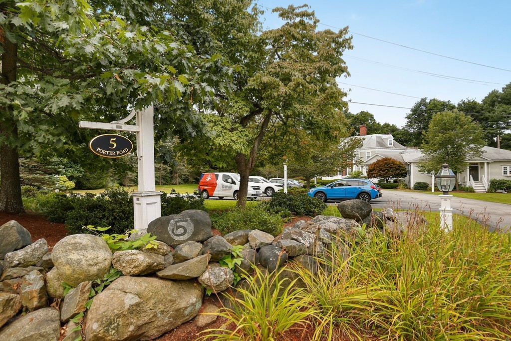 5 Porter Road, Unit A2 Andover, MA 01810 - Photo 3 of 22 a front view of a house with a yard and fountain