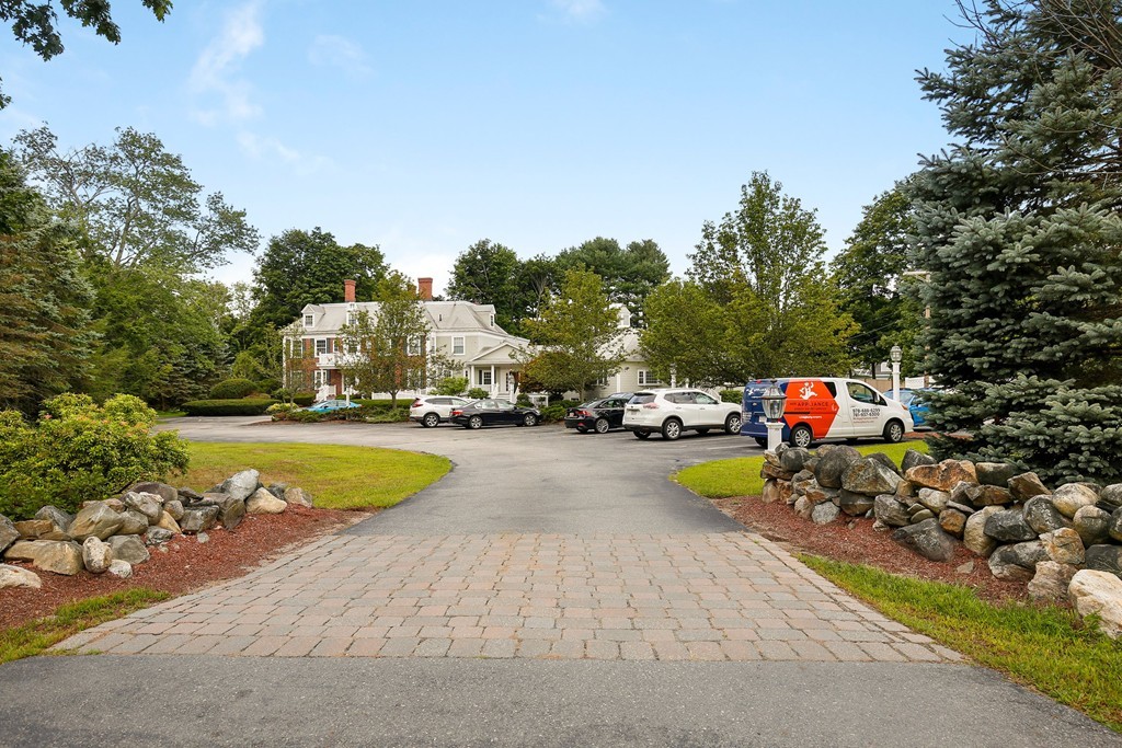 5 Porter Road, Unit A2 Andover, MA 01810 - Photo 4 of 22 a view of a swimming pool with a patio and yard