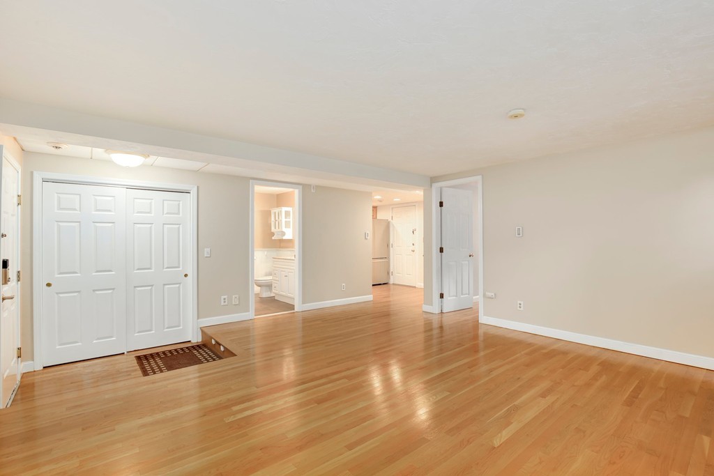 5 Porter Road, Unit A2 Andover, MA 01810 - Photo 5 of 22 a view of an empty room with wooden floor