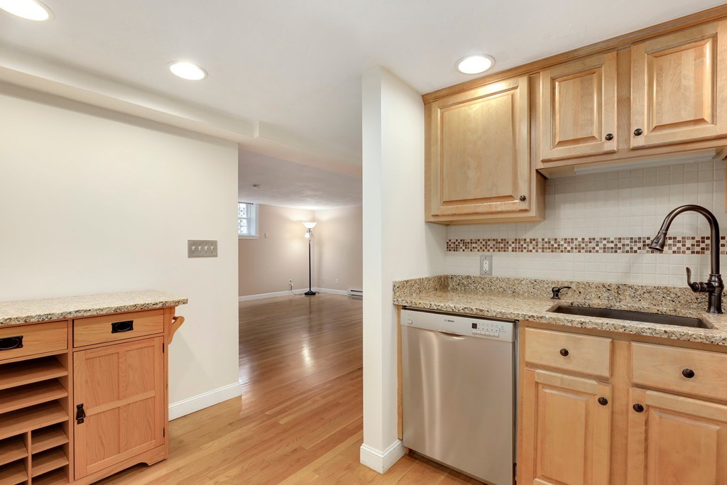 5 Porter Road, Unit A2 Andover, MA 01810 - Photo 10 of 22 a kitchen with granite countertop a sink and cabinets