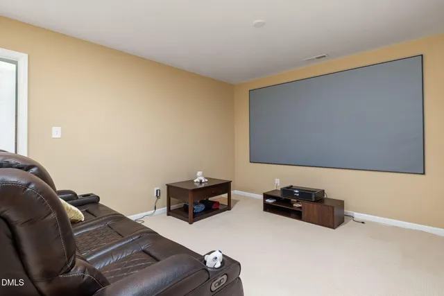 a room with furniture and screen